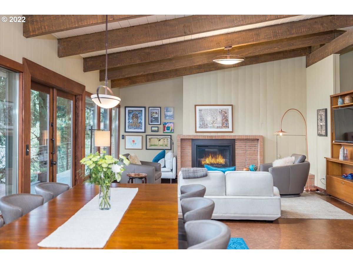 3837 Southwest Dosch Road Portland, OR 97239 - Photo 9 of 32 a living room with furniture and a fireplace