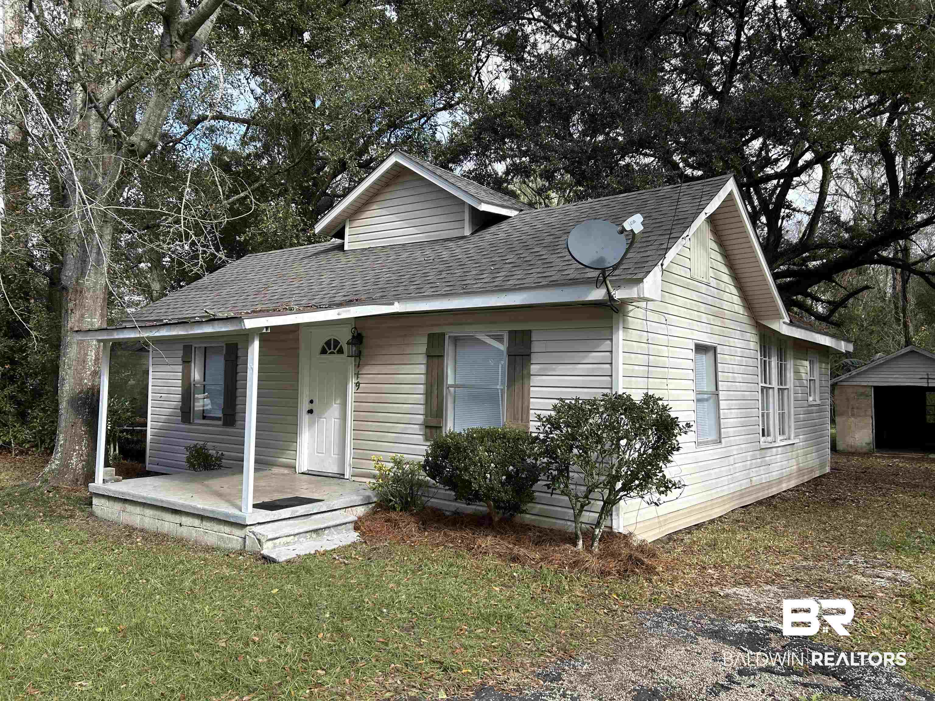 2119 Hoppin Street Mobile, AL 36605 - Photo 2 of 23 View of front of property with a porch, a shed, and a front lawn