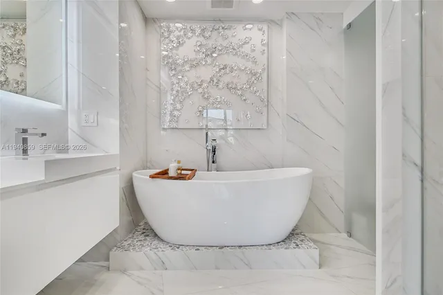 a white bath tub sitting in a bathroom