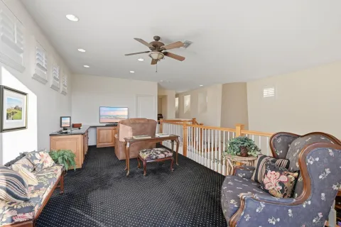 a building outdoor space with patio furniture and potted plants