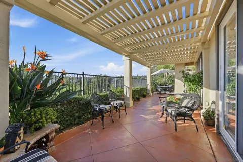 a aerial view of a house with a big yard and large trees