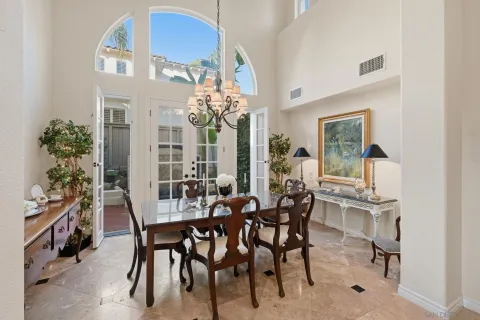 a living room with furniture fireplace and a large window
