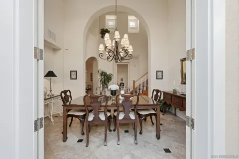 a living room with furniture city view and large windows