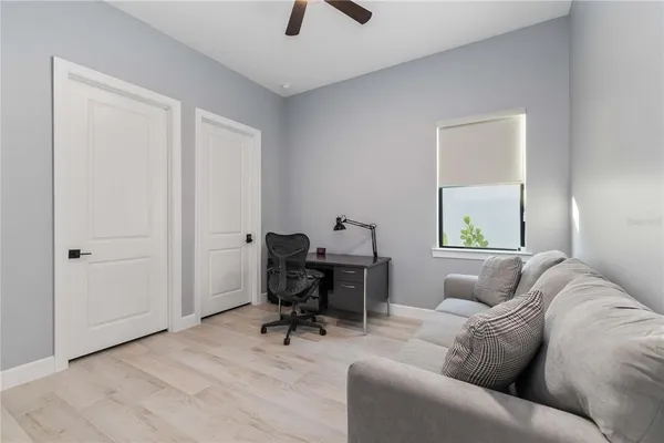 a living room with furniture and a window