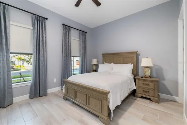 a spacious bedroom with a bed and a window