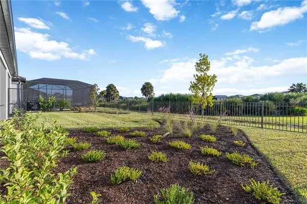 a view of a lake with houses in the back
