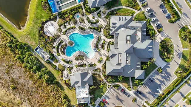 an aerial view of a house with garden space and street view