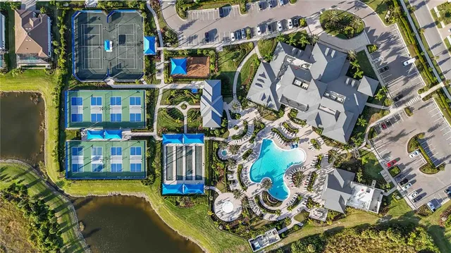 a house that has a palm trees in front of it