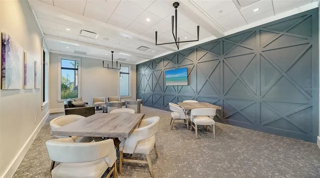 a view of a dining room with furniture window and outside view