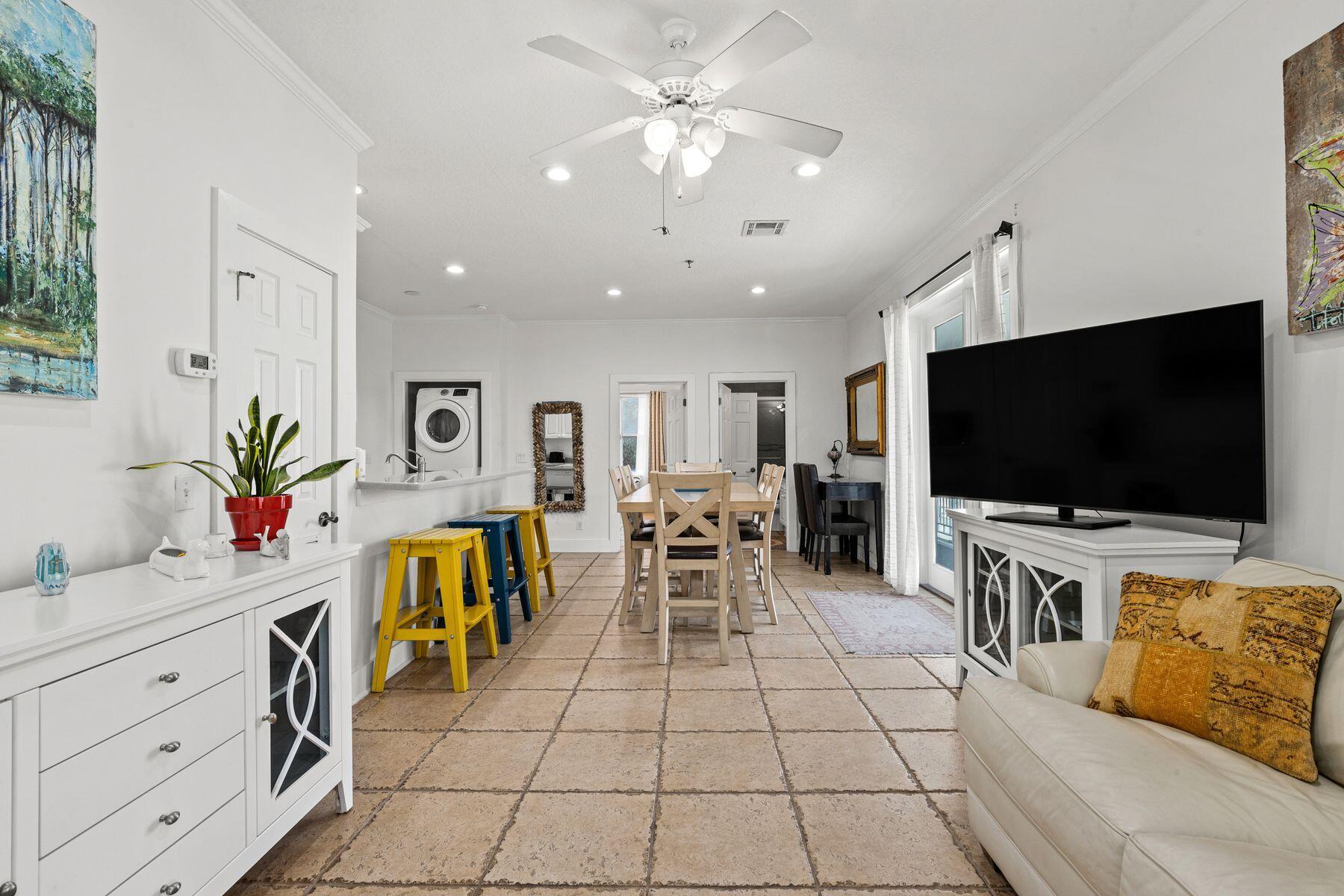 120 Quincy Circle Santa Rosa Beach, FL 32459 - Photo 17 of 26 a living room with furniture and a flat screen tv
