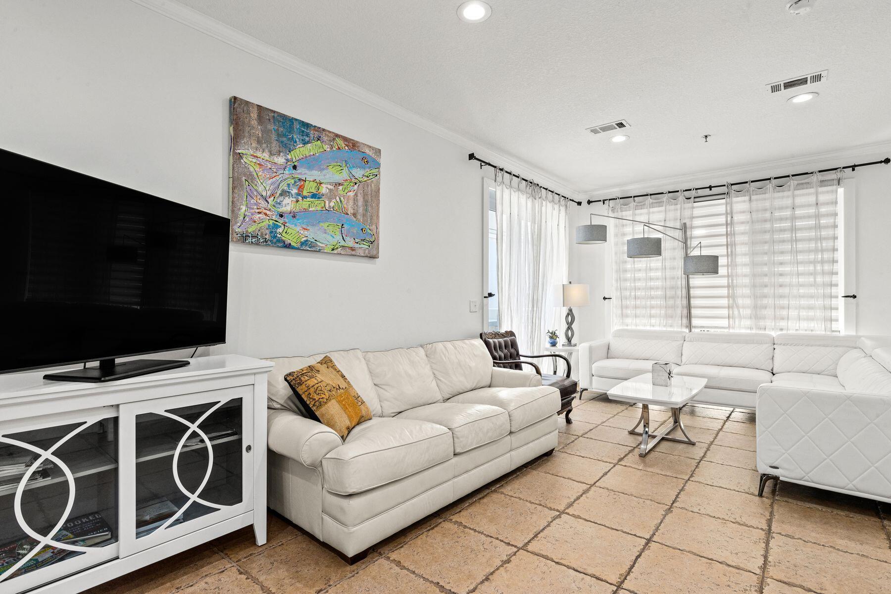 120 Quincy Circle Santa Rosa Beach, FL 32459 - Photo 18 of 26 a living room with furniture and a flat screen tv