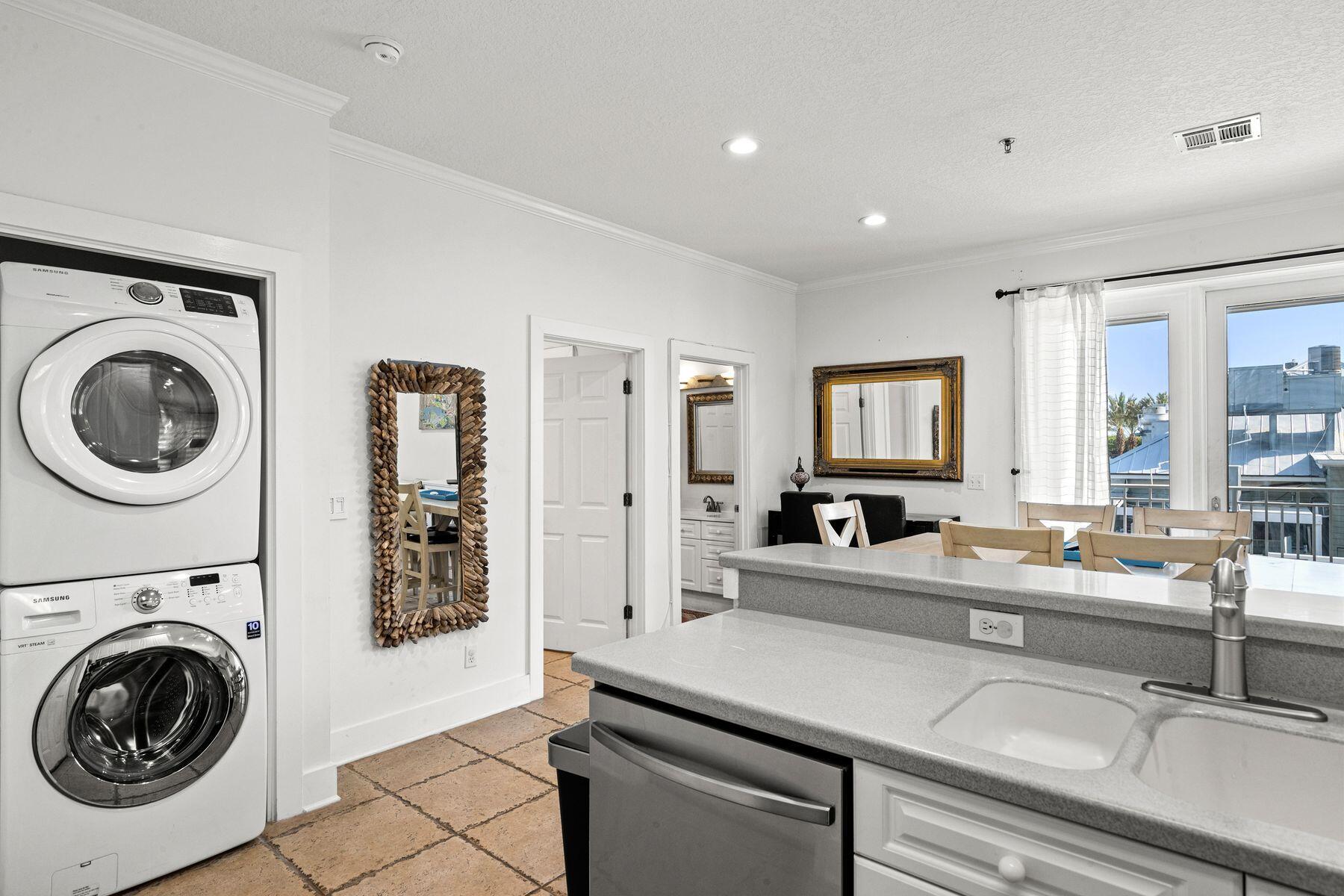 120 Quincy Circle Santa Rosa Beach, FL 32459 - Photo 20 of 26 a view of a kitchen with a sink and a washer dryer