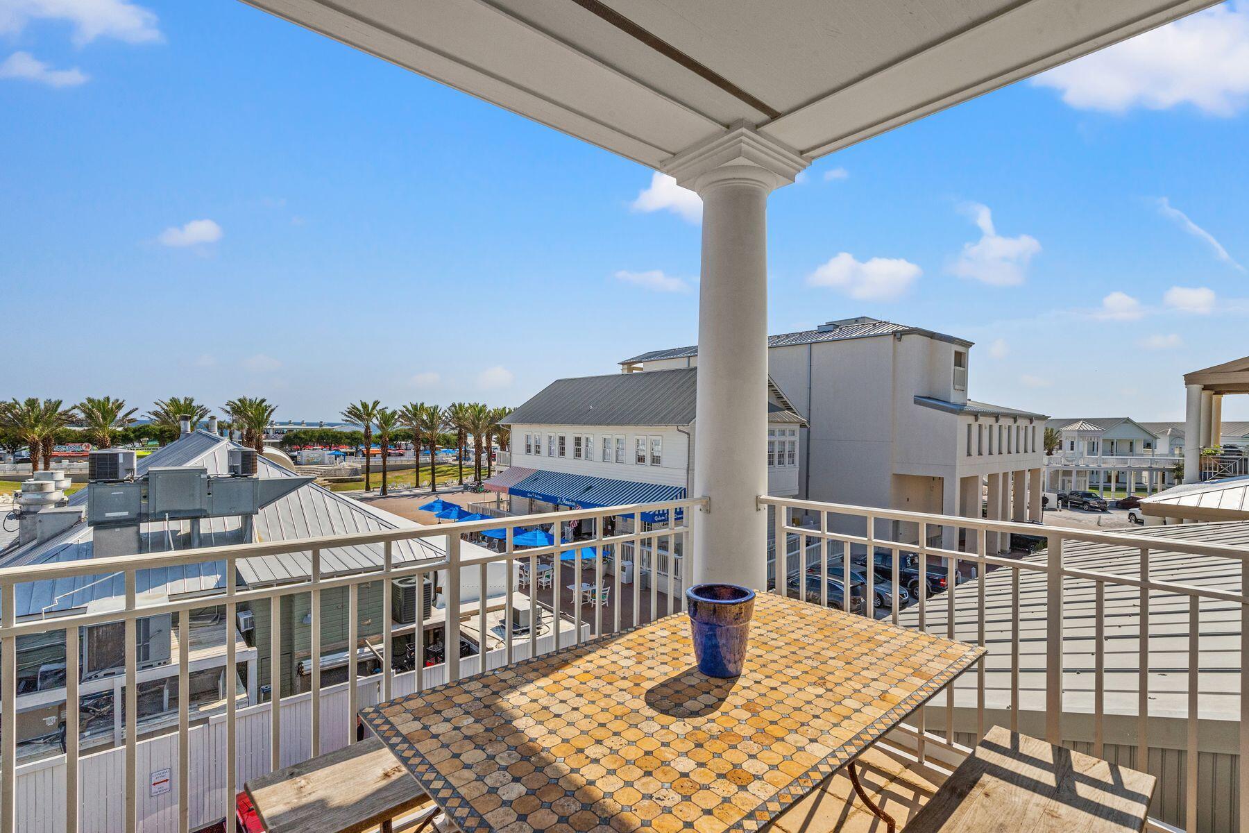 120 Quincy Circle Santa Rosa Beach, FL 32459 - Photo 6 of 26 a view of a balcony with two chairs and a table
