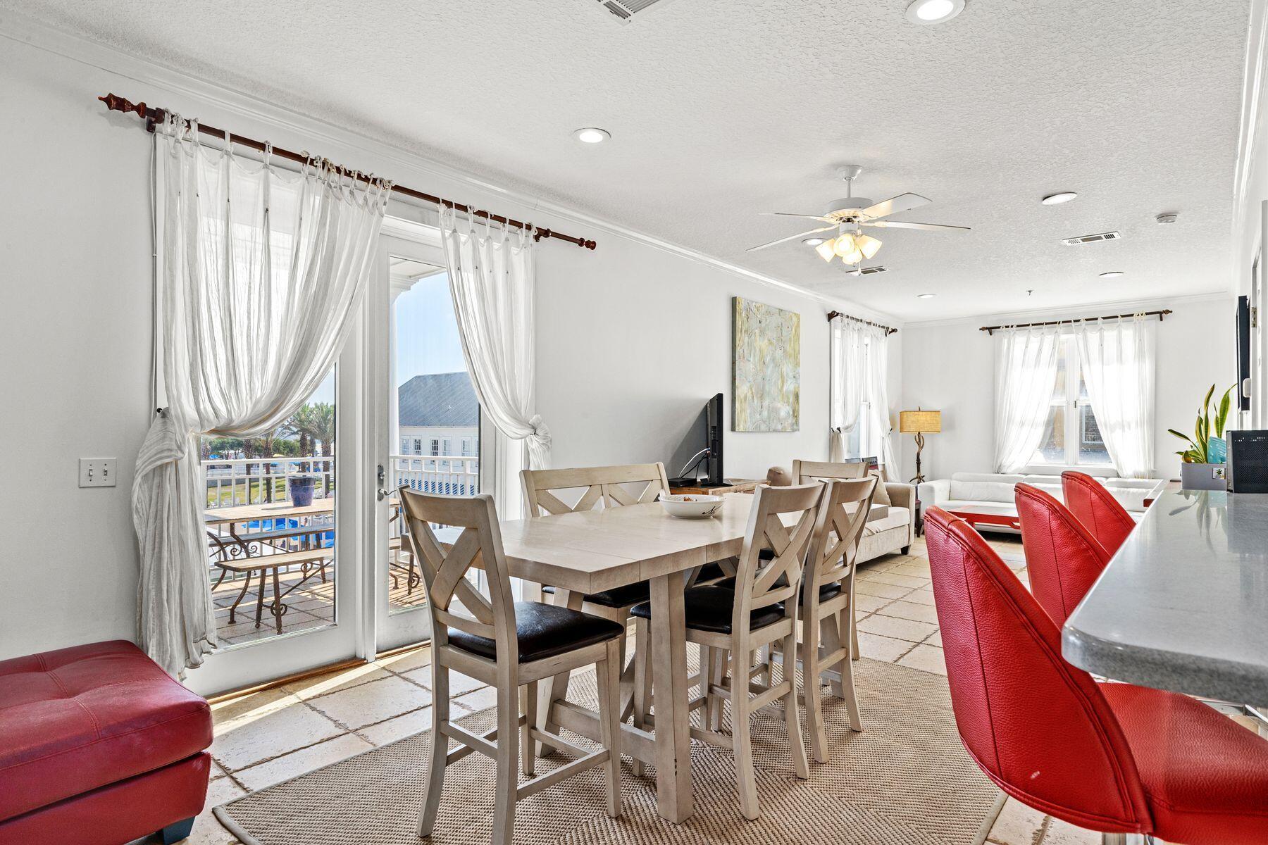120 Quincy Circle Santa Rosa Beach, FL 32459 - Photo 7 of 26 a view of a dining room with furniture window and wooden floor