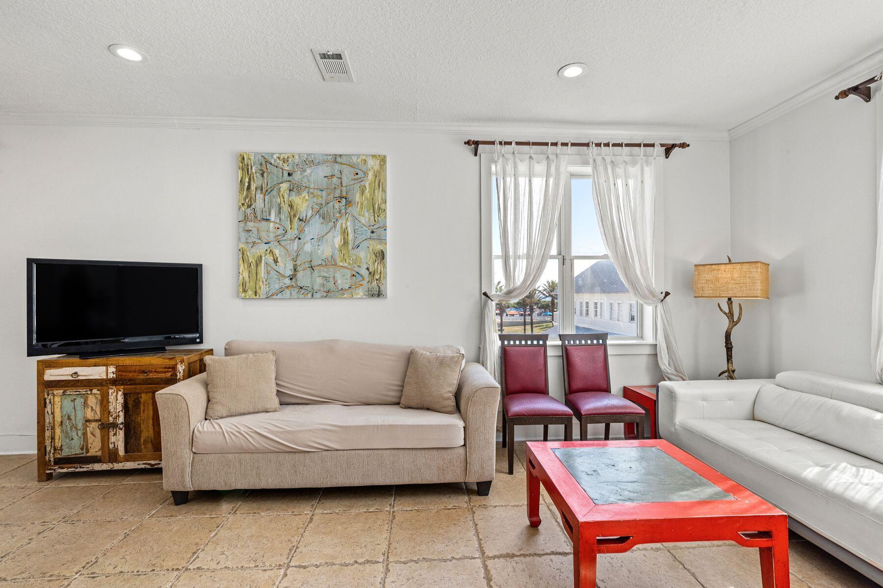 120 Quincy Circle Santa Rosa Beach, FL 32459 - Photo 9 of 26 a living room with furniture and a flat screen tv