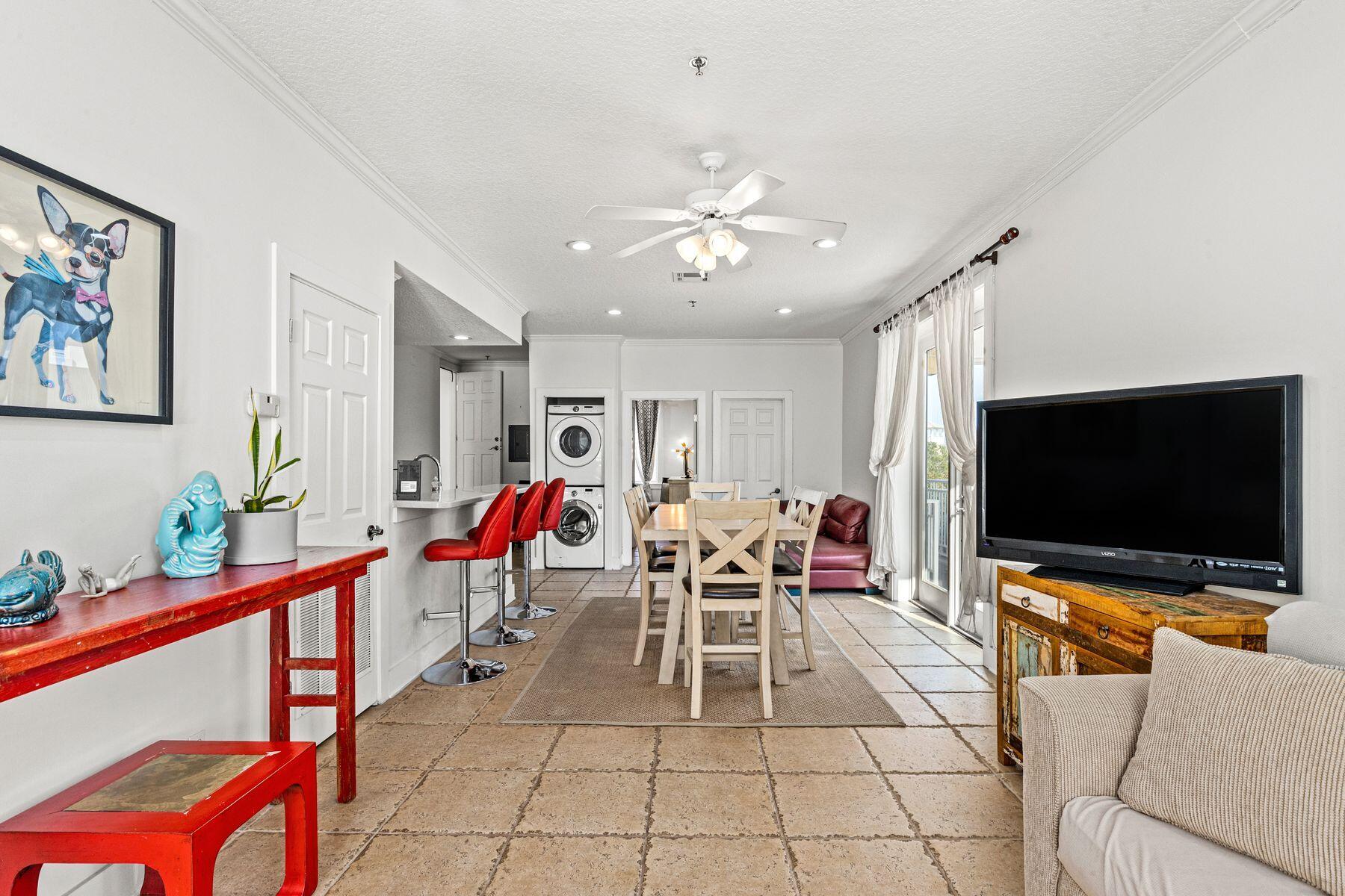 120 Quincy Circle Santa Rosa Beach, FL 32459 - Photo 10 of 26 a living room with furniture and a flat screen tv