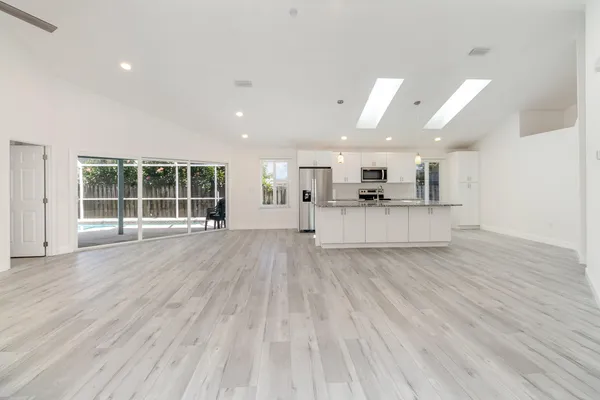 a view of kitchen with cabinets and stainless steel appliances