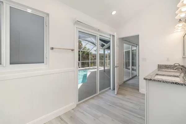 a view of a kitchen cabinets and wooden floor