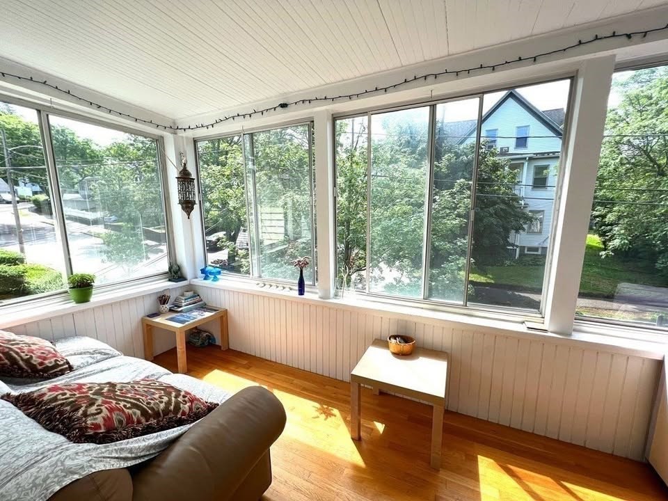 a living room with furniture and a large window