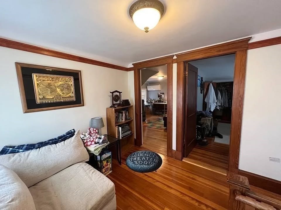 29 Richie Road, Unit 2 Quincy, MA 02169 - Photo 14 of 30 a living room with furniture and a wooden floor