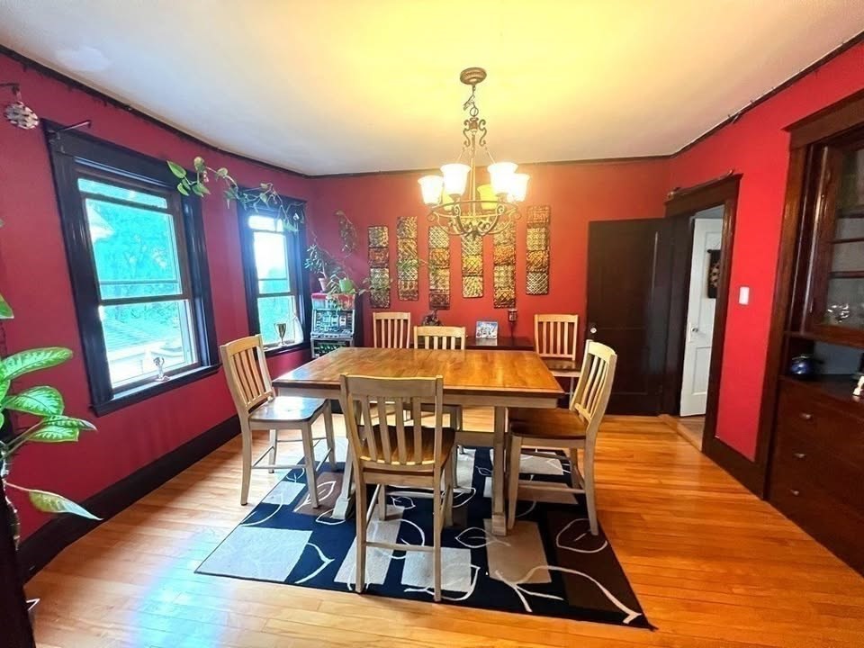 29 Richie Road, Unit 2 Quincy, MA 02169 - Photo 2 of 30 a view of a dining room with furniture a chandelier and wooden floor