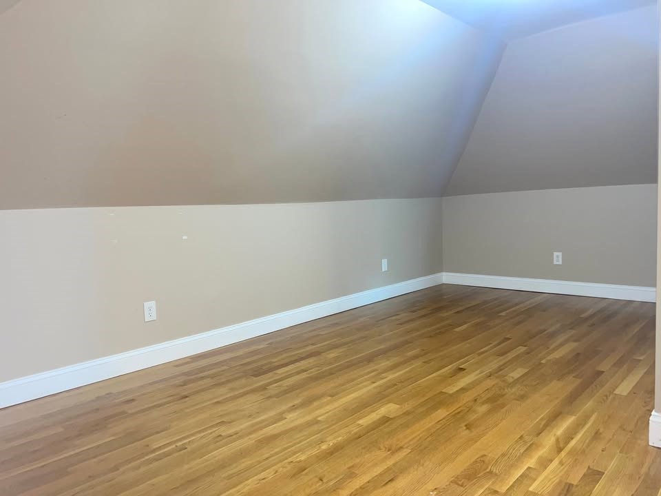 29 Richie Road, Unit 2 Quincy, MA 02169 - Photo 21 of 30 a view of an empty room with wooden floor