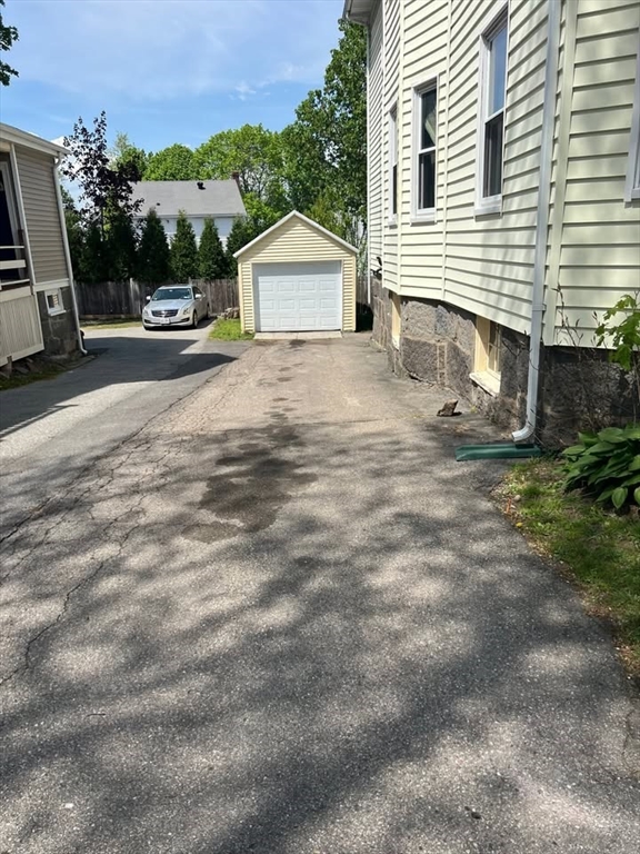 29 Richie Road, Unit 2 Quincy, MA 02169 - Photo 25 of 30 a view of a house with backyard and sitting area