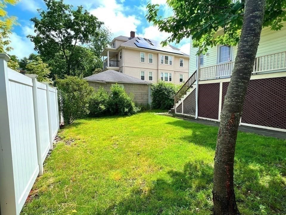 29 Richie Road, Unit 2 Quincy, MA 02169 - Photo 28 of 30 a view of a house with a yard and large trees