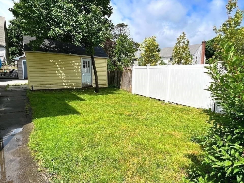 29 Richie Road, Unit 2 Quincy, MA 02169 - Photo 29 of 30 a view of a back yard of the house