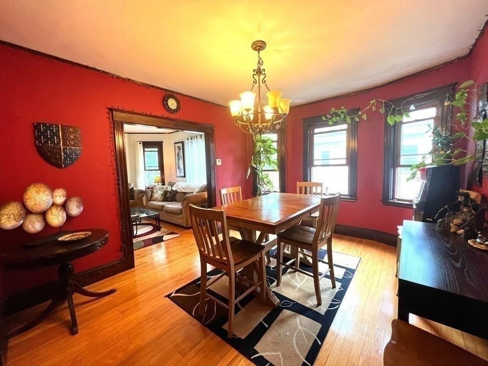 29 Richie Road, Unit 2 Quincy, MA 02169 - Photo 3 of 30 a view of a dining room with furniture and a chandelier