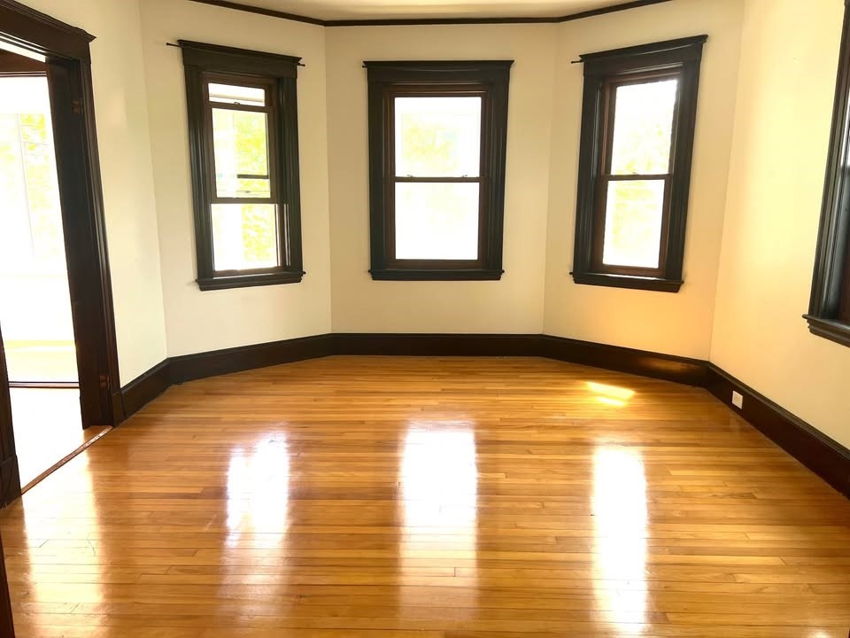 29 Richie Road, Unit 2 Quincy, MA 02169 - Photo 7 of 30 a view of empty room with window and wooden floor