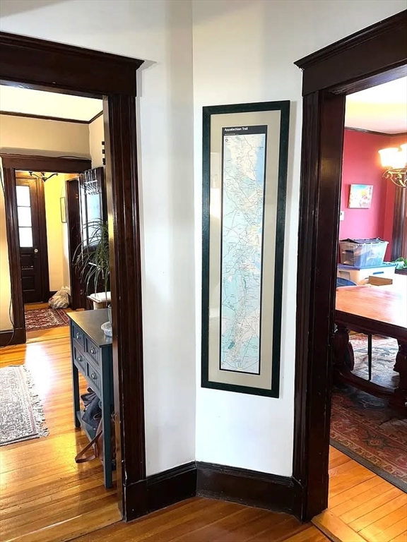 29 Richie Road, Unit 2 Quincy, MA 02169 - Photo 8 of 30 a view of a hallway with wooden floor and dining room