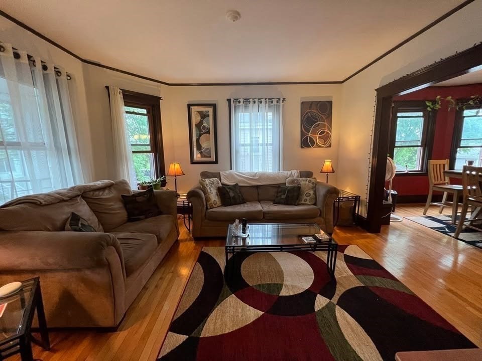 29 Richie Road, Unit 2 Quincy, MA 02169 - Photo 9 of 30 a living room with furniture and wooden floor
