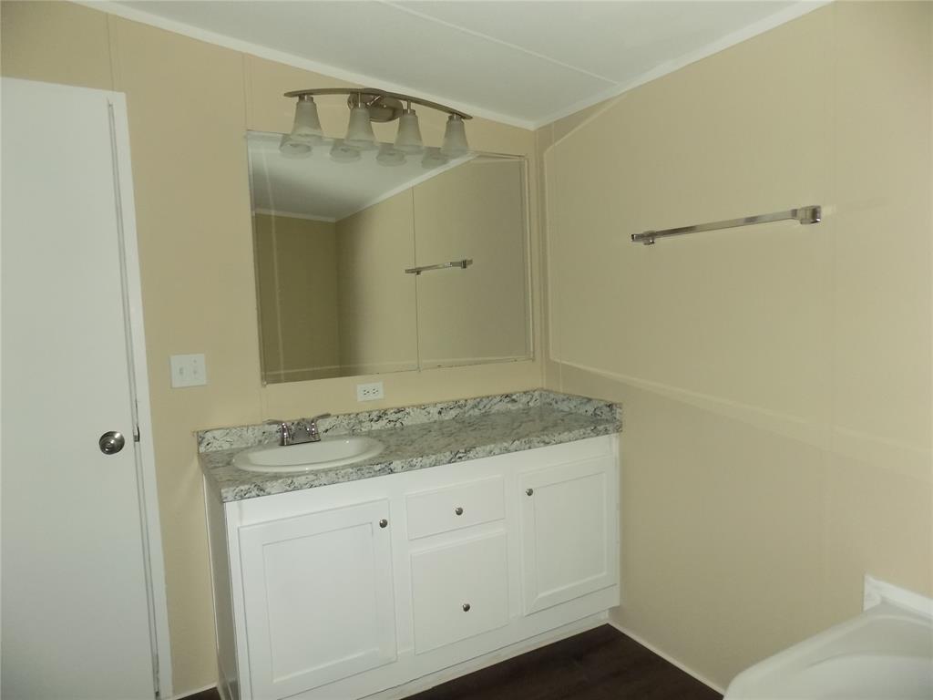 203 South Ridgeview Court Azle, TX 76020 - Photo 10 of 29 Welcoming primary bathroom.