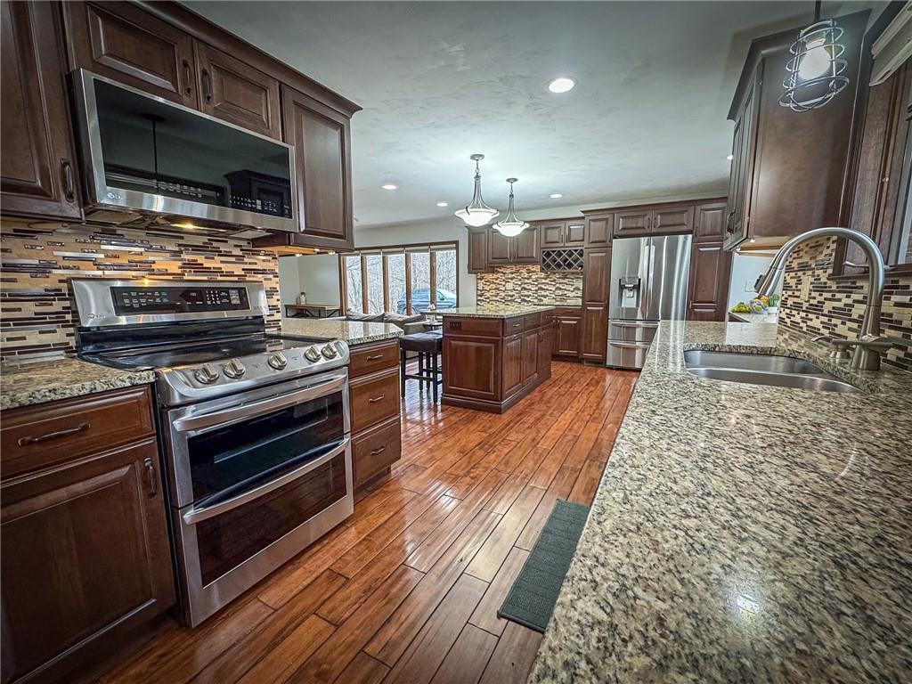 706 Clearfield Road Fenelton, PA 16034 - Photo 13 of 50 a kitchen with wooden cabinets and stainless steel appliances