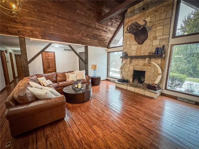a living room with furniture or fireplace and a wooden floor