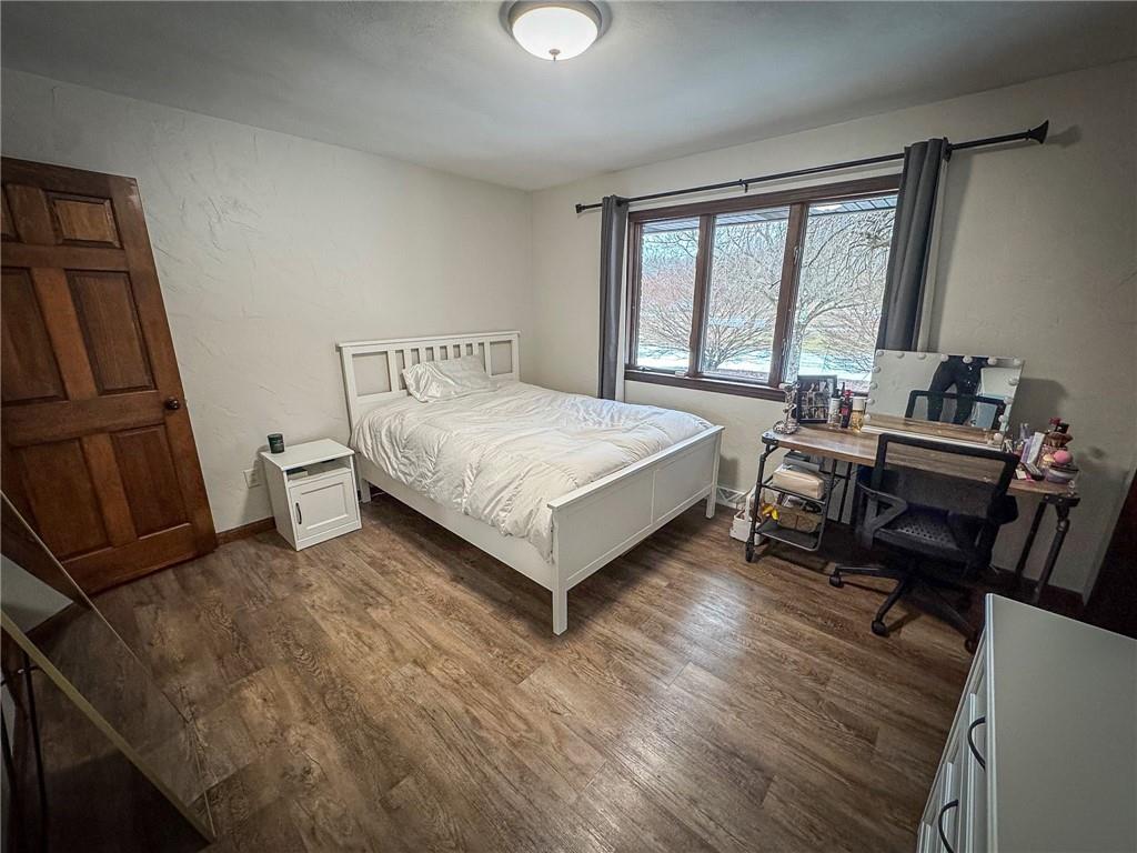 706 Clearfield Road Fenelton, PA 16034 - Photo 29 of 50 a bedroom with a bed and a large window