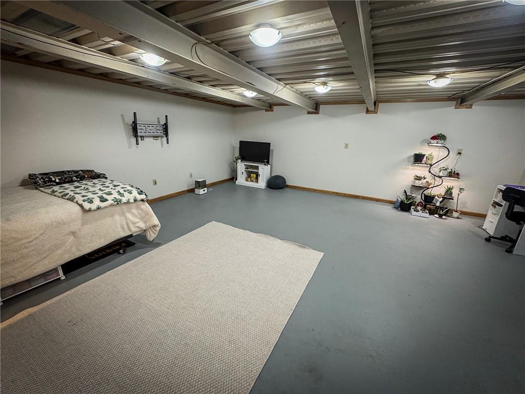 706 Clearfield Road Fenelton, PA 16034 - Photo 40 of 50 a bed room with a bed and a couch