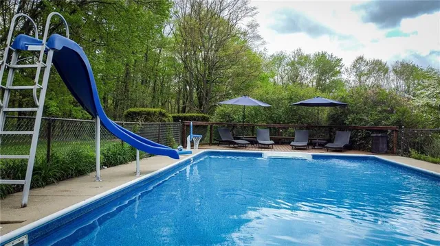 a view of a swimming pool with a patio