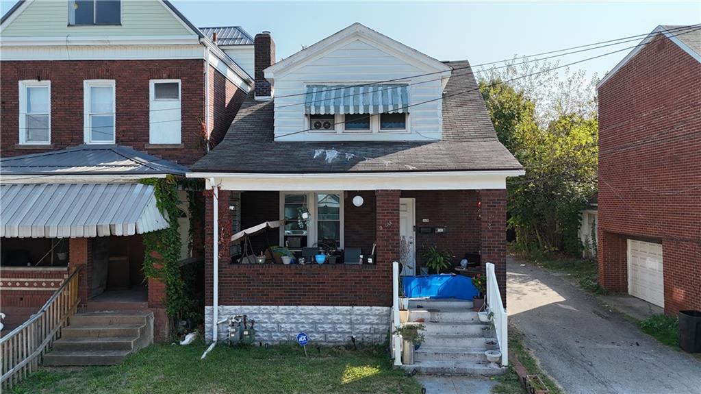 428 Agatha Street Pitcairn, PA 15140 - Photo 4 of 6 a front view of a house with garden