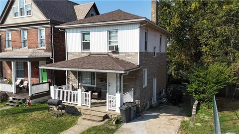 a front view of a house with a porch