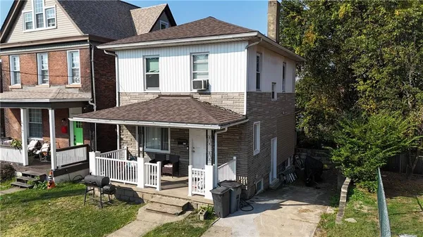 a front view of a house with a porch