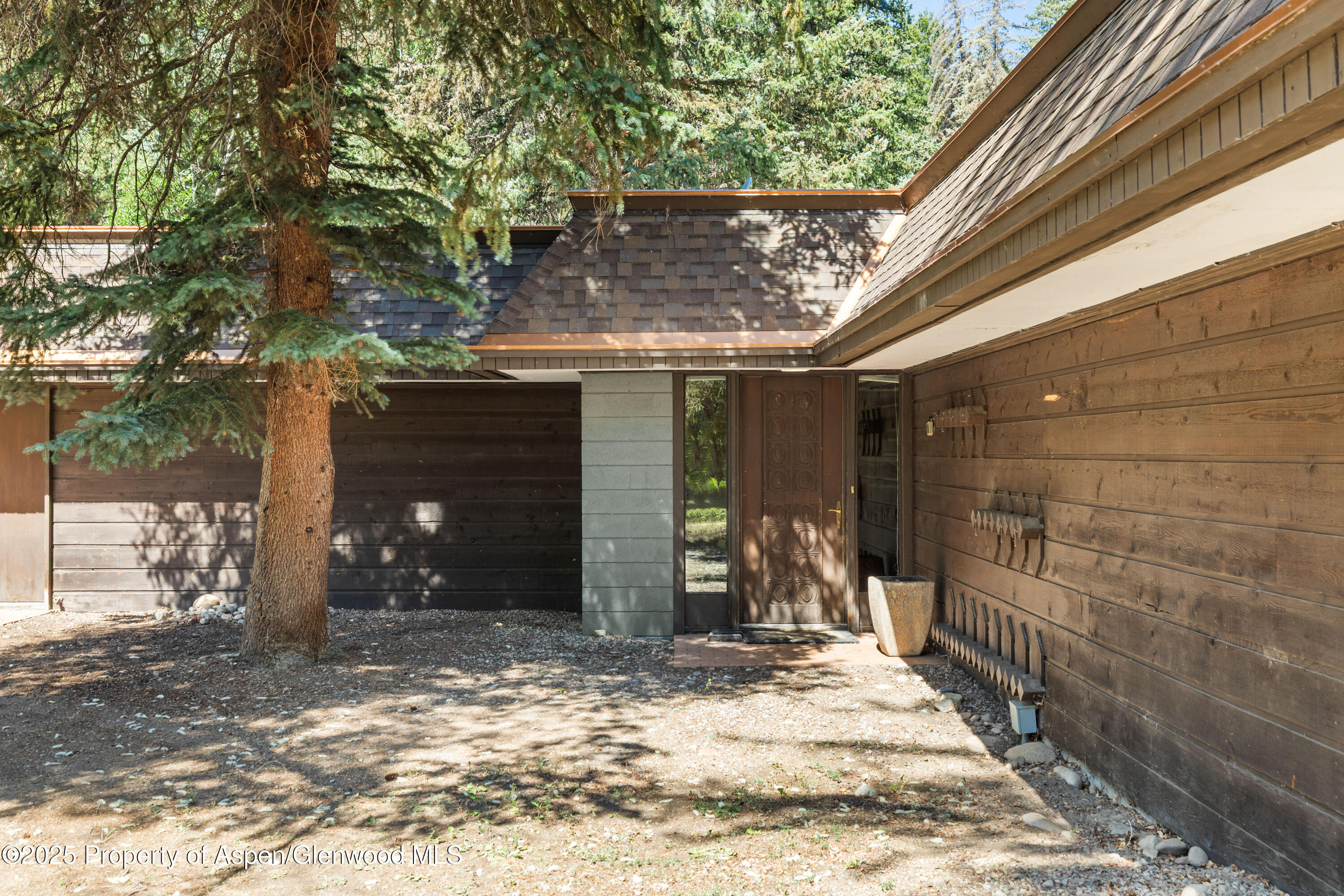 820 Twining Flats Road Aspen, CO 81611 - Photo 2 of 15 a front view of a house with a yard