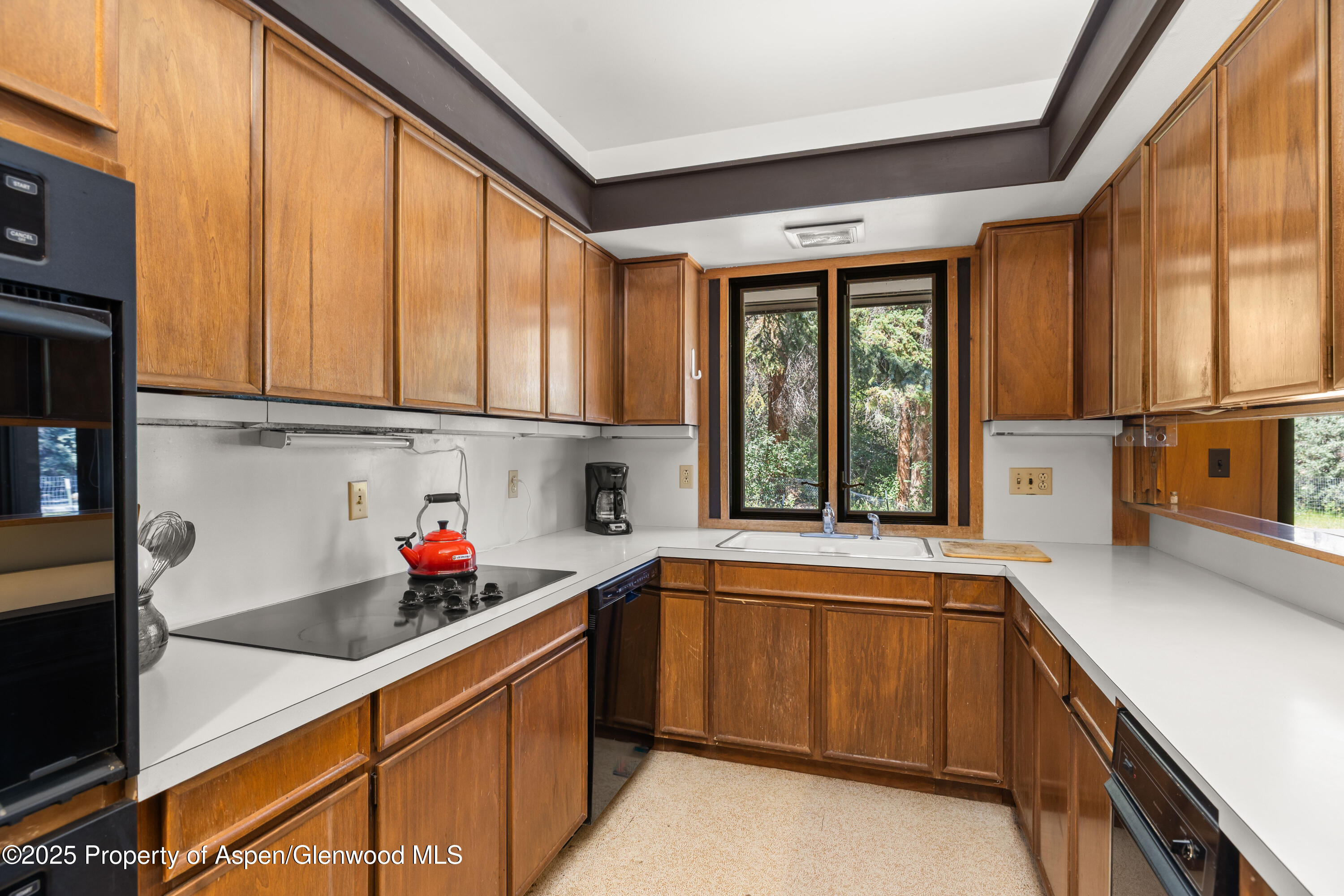 820 Twining Flats Road Aspen, CO 81611 - Photo 8 of 15 a kitchen with a sink cabinets and window