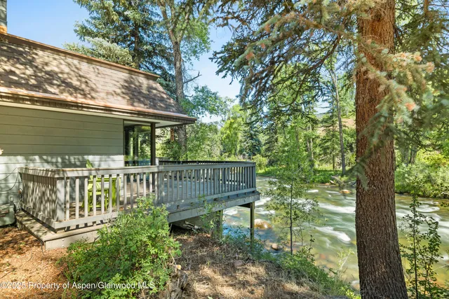 a view of a chair and table in the balcony