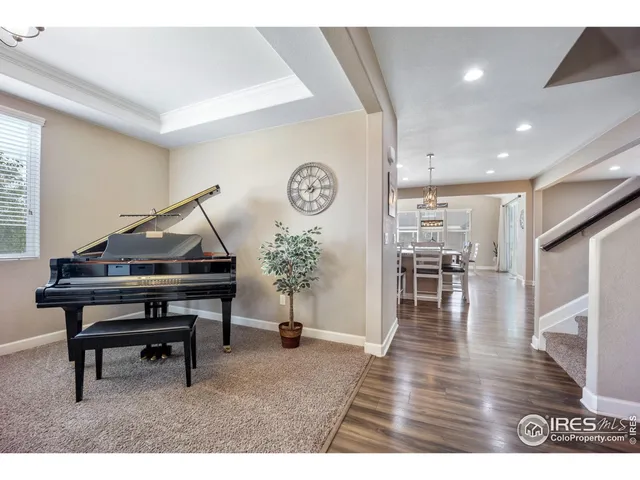 a room with furniture and wooden floor