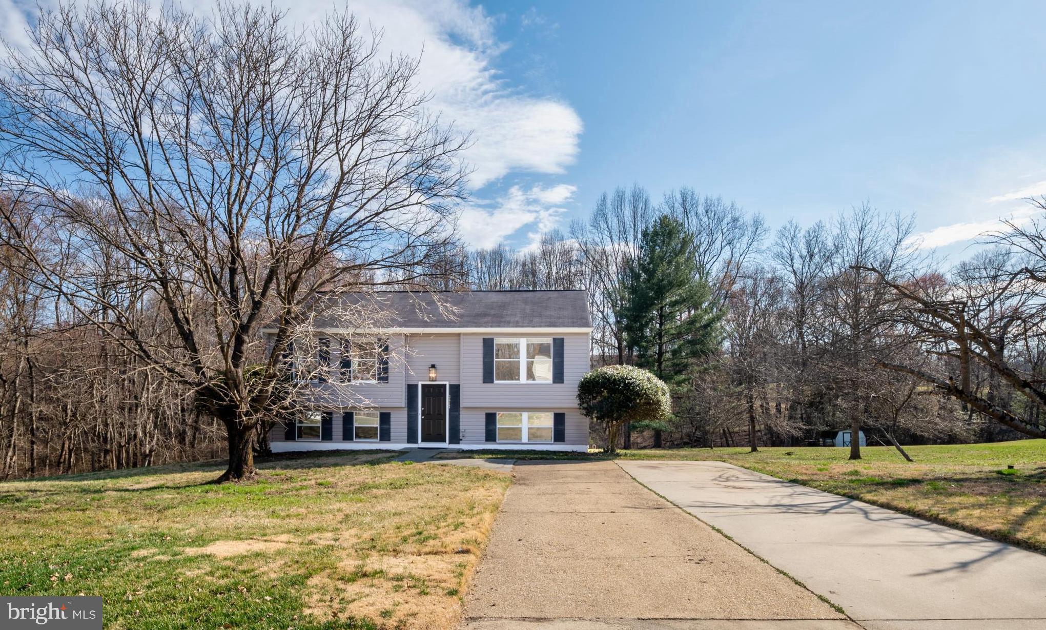 3617 Ripplingbrook Court Bowie, MD 20721 - Photo 1 of 29 a view of a house with a yard and large trees