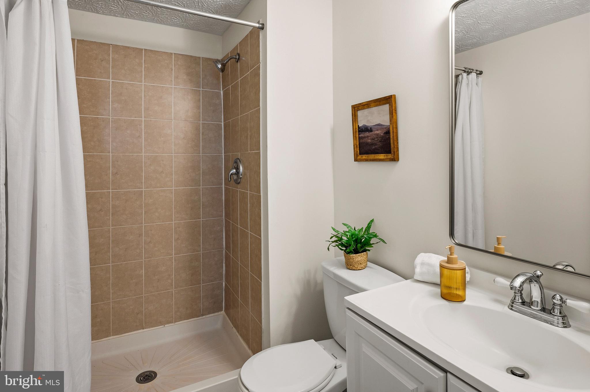 3617 Ripplingbrook Court Bowie, MD 20721 - Photo 21 of 29 a bathroom with a sink a toilet and shower