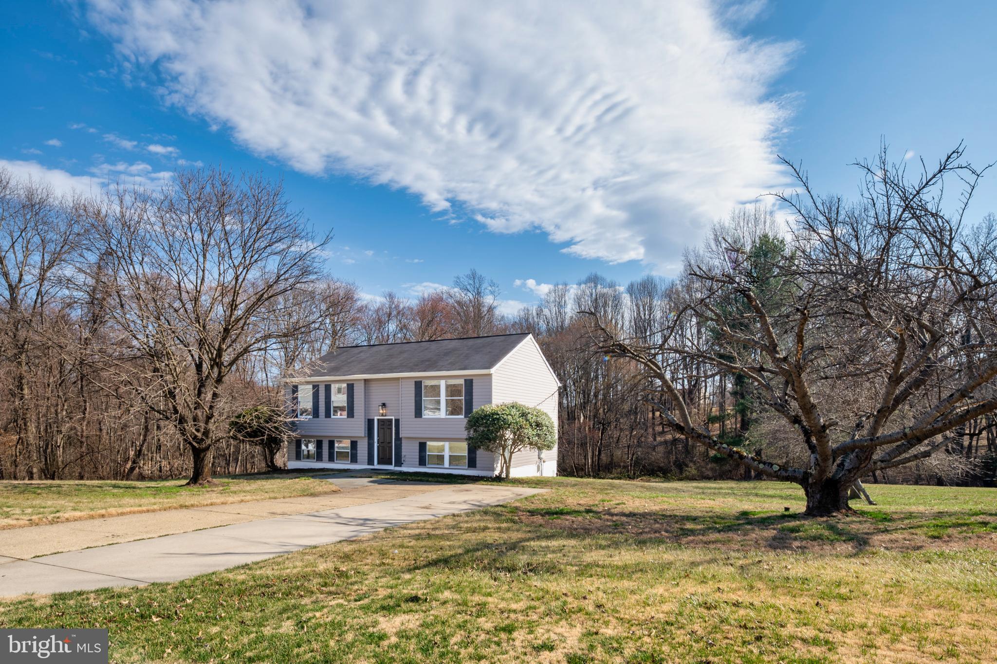3617 Ripplingbrook Court Bowie, MD 20721 - Photo 27 of 29 a front view of a house with a yard and covered with snow