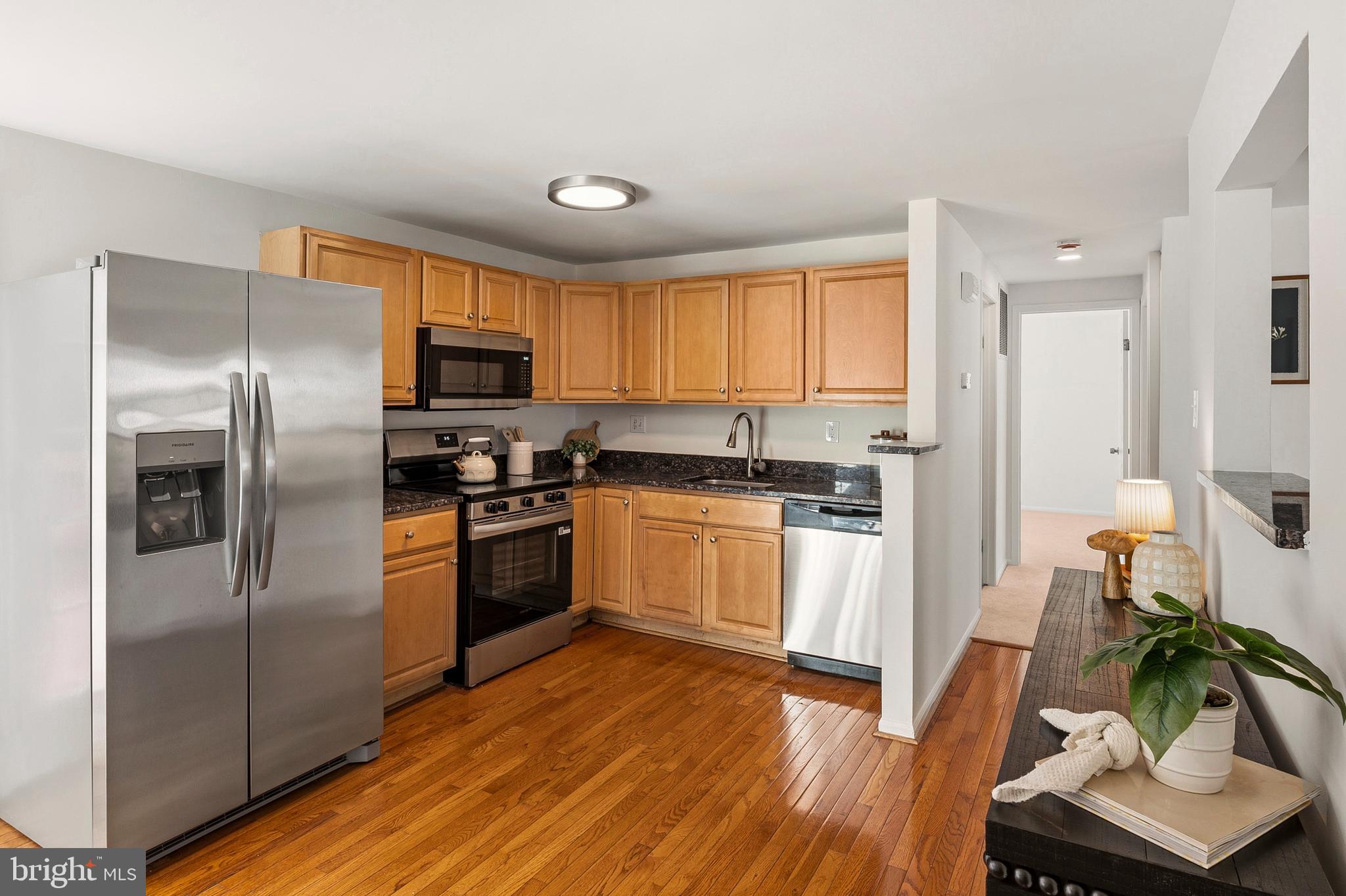 3617 Ripplingbrook Court Bowie, MD 20721 - Photo 8 of 29 a kitchen with a refrigerator and a stove top oven